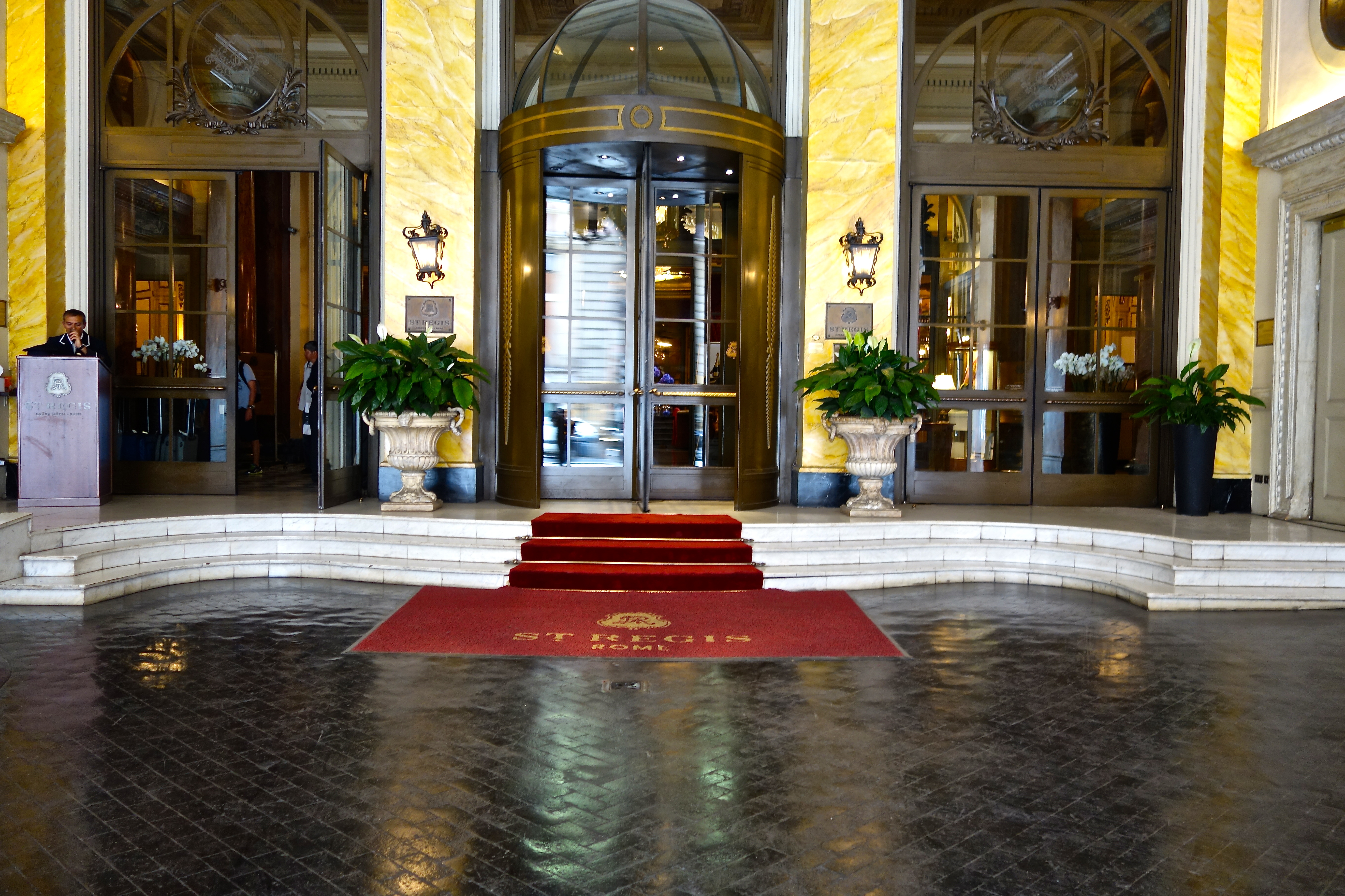 a building with a red carpet and a door