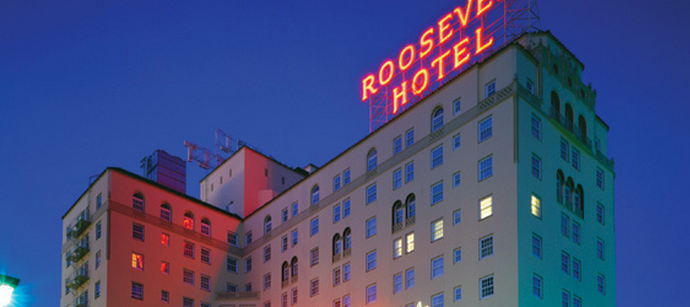 a hotel with neon lights