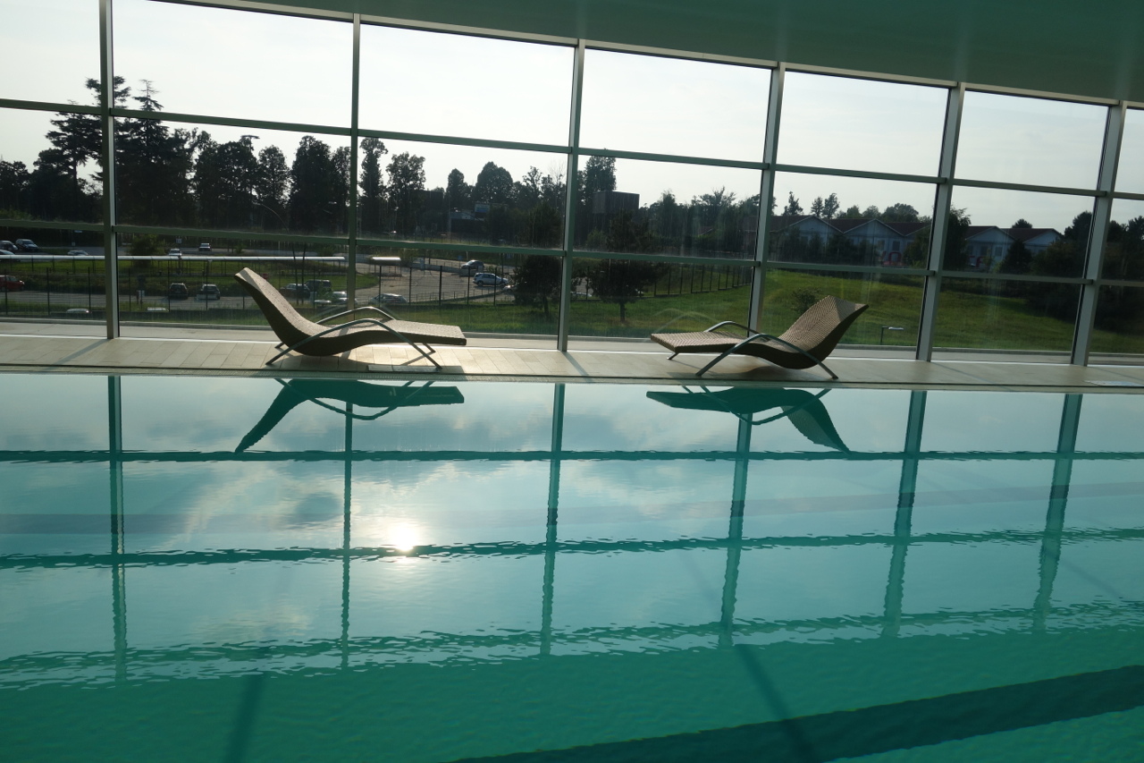 a pool with chairs in it
