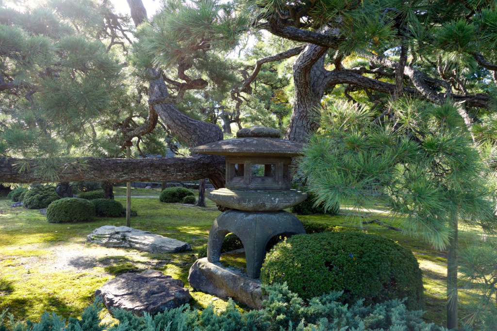 a stone pagoda in a garden