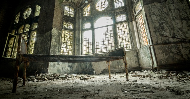 a bed in a ruined room
