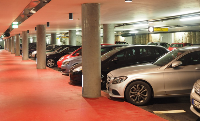 a parking garage with several cars