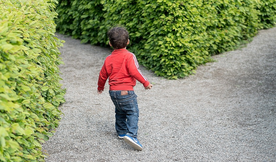 a child walking on gravel