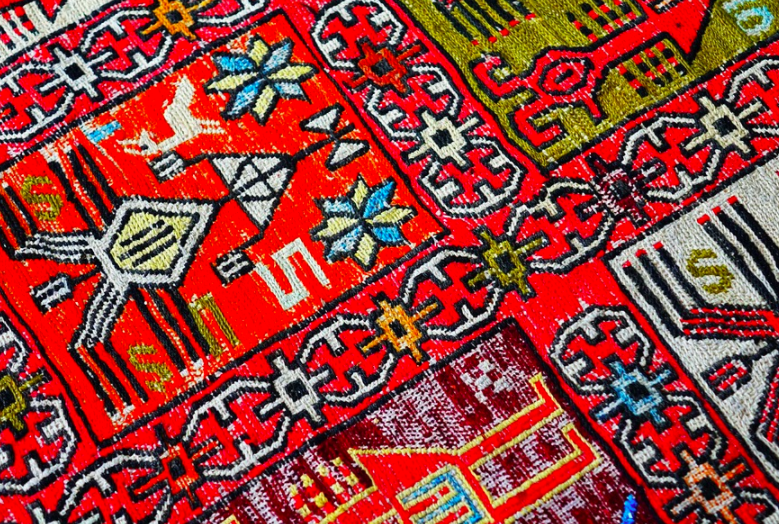 a close up of a colorful rug